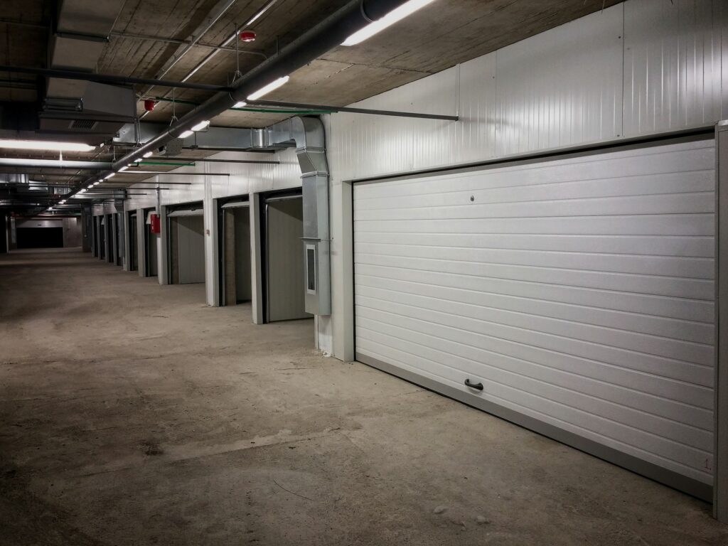 Garage building made of concrete with roller shutter doors